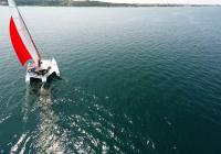 trimaran sailing blue sea
